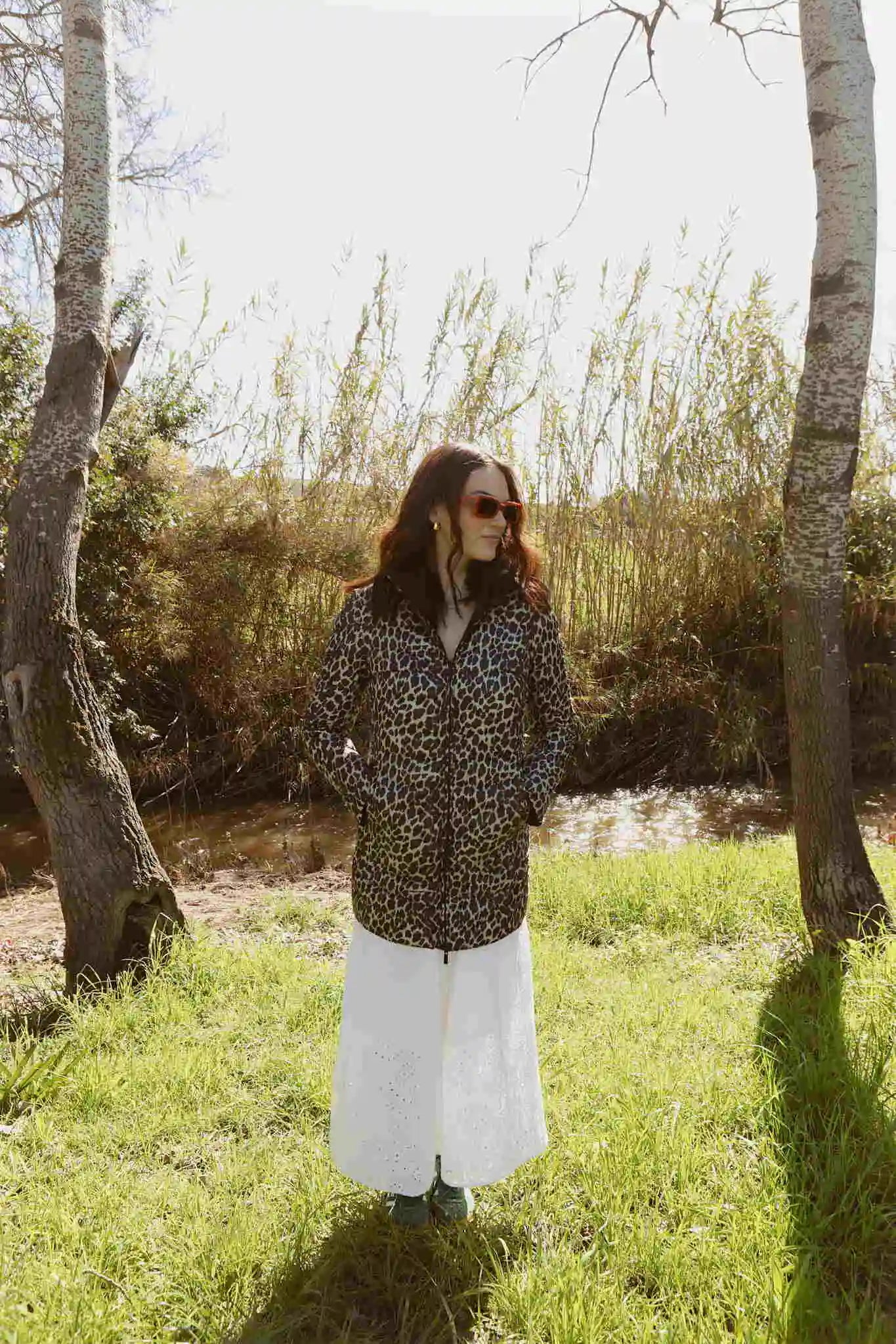 Women’s insulated reversible hooded parka in leopard print and midnight black, designed for warmth and comfort in South Africa’s winter season — Midnight x Leopard Classic Parka™