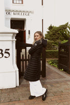 Women’s insulated ultra-length hooded parka in midnight black, designed for extra warmth and comfort in South Africa’s winter season — Midnight Ultra Parka™