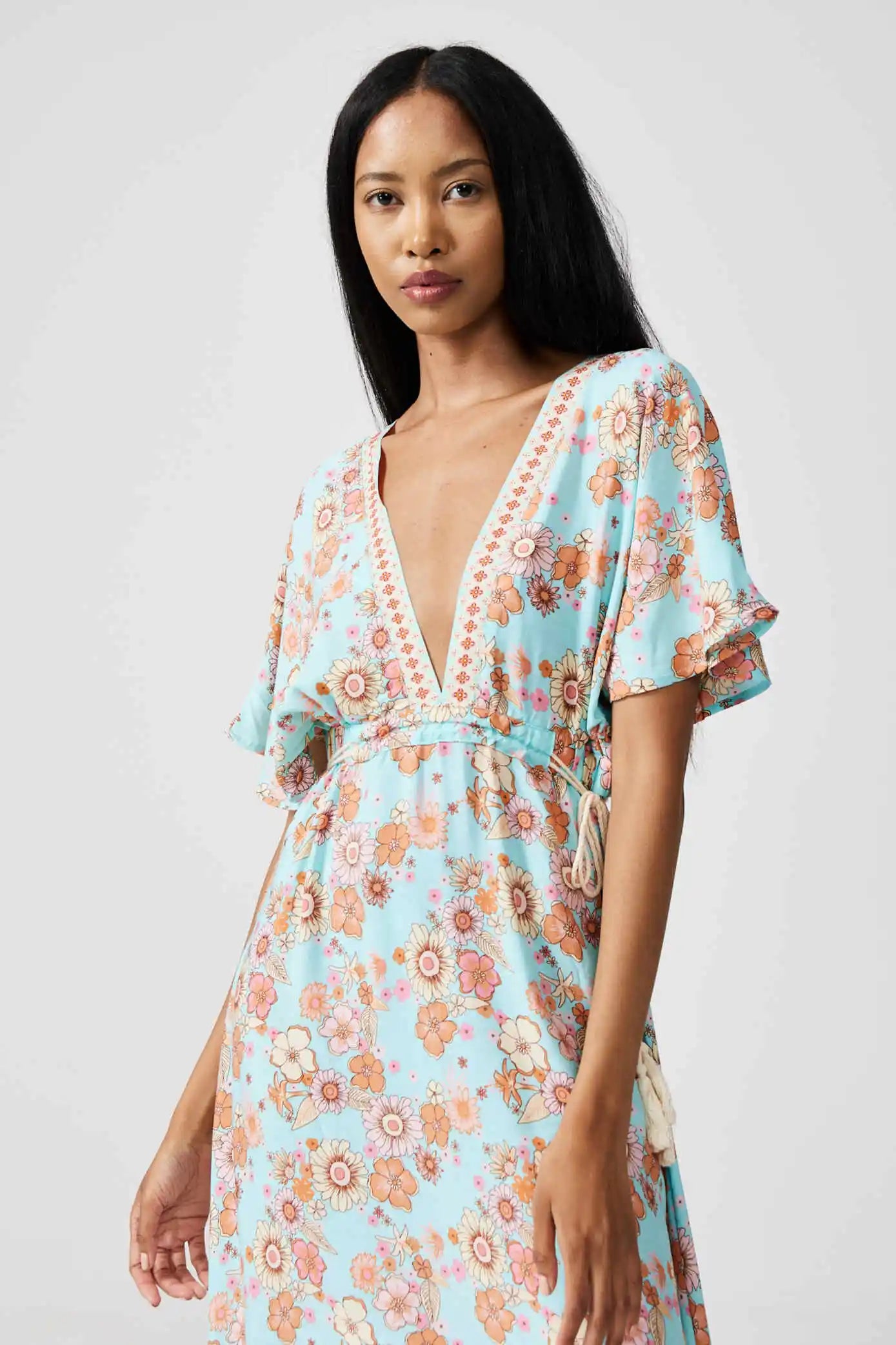 Women’s floral sundress in light blue and pink with a deep V-neck and flowy fit, lightweight summer dress from Duck Apparel South Africa
