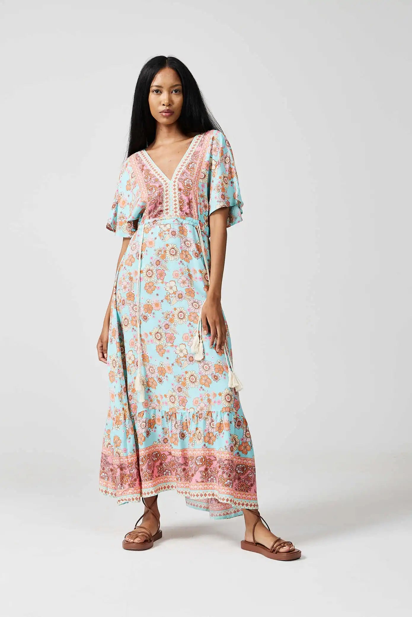 Women’s floral sundress in light blue and pink with a deep V-neck and flowy fit, lightweight summer dress from Duck Apparel South Africa