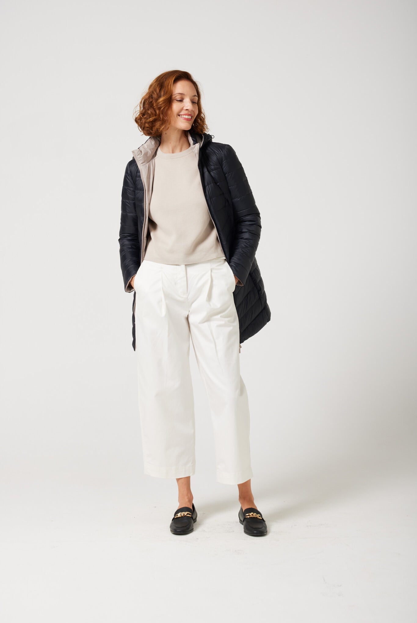 Women’s insulated reversible hooded parka in ebony black and ivory, designed for warmth and comfort in South Africa’s winter season — Ebony x Ivory Classic Parka™