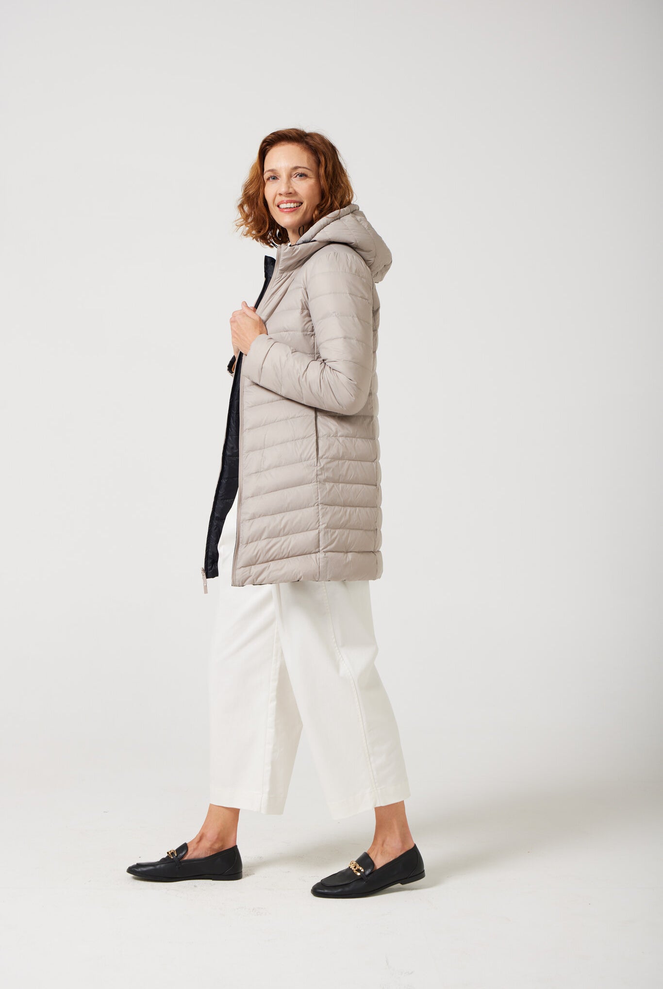 Women’s insulated reversible hooded parka in ebony black and ivory, designed for warmth and comfort in South Africa’s winter season — Ebony x Ivory Classic Parka™