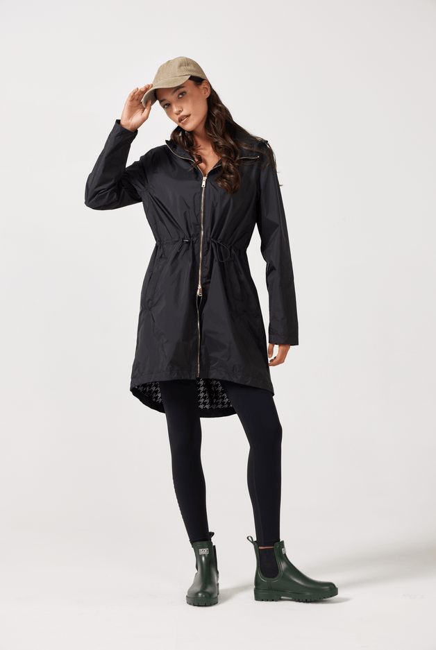The Highland Midnight raincoat in classic black, lightweight hooded waterproof raincoat ideal for South Africa’s rainy season and wet climate