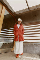Women’s insulated hooded parka in rust red, designed for warmth and comfort in South Africa’s winter season — Rust Classic Parka™