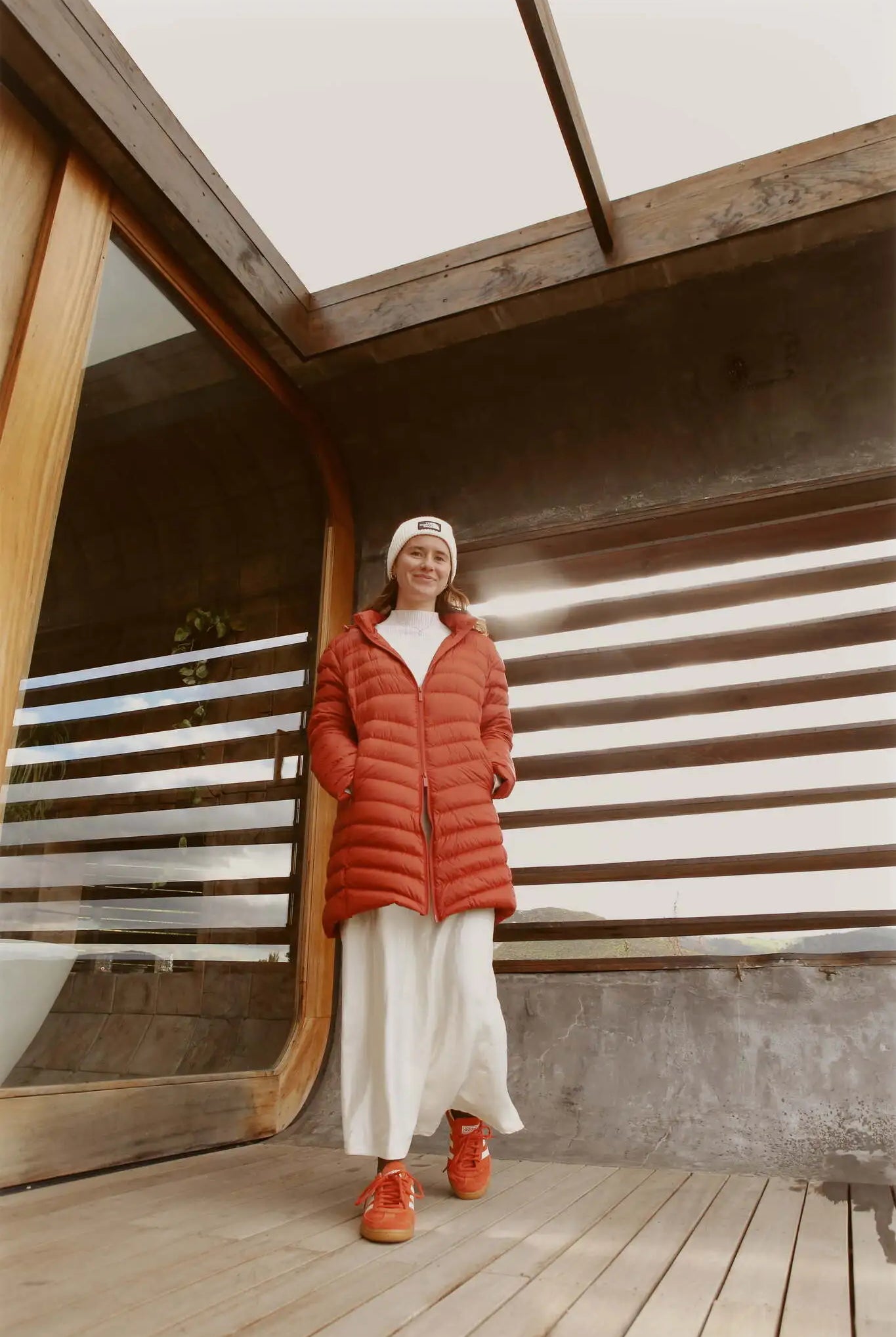 Women’s insulated hooded parka in rust red, designed for warmth and comfort in South Africa’s winter season — Rust Classic Parka™