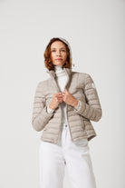 Women’s Latte Classic Jacket™ in a soft beige shade, lightweight puffer jacket with hood, perfect for layering during cool South African weather