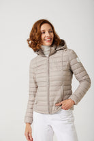 Women’s Latte Classic Jacket™ in a soft beige shade, lightweight puffer jacket with hood, perfect for layering during cool South African weather