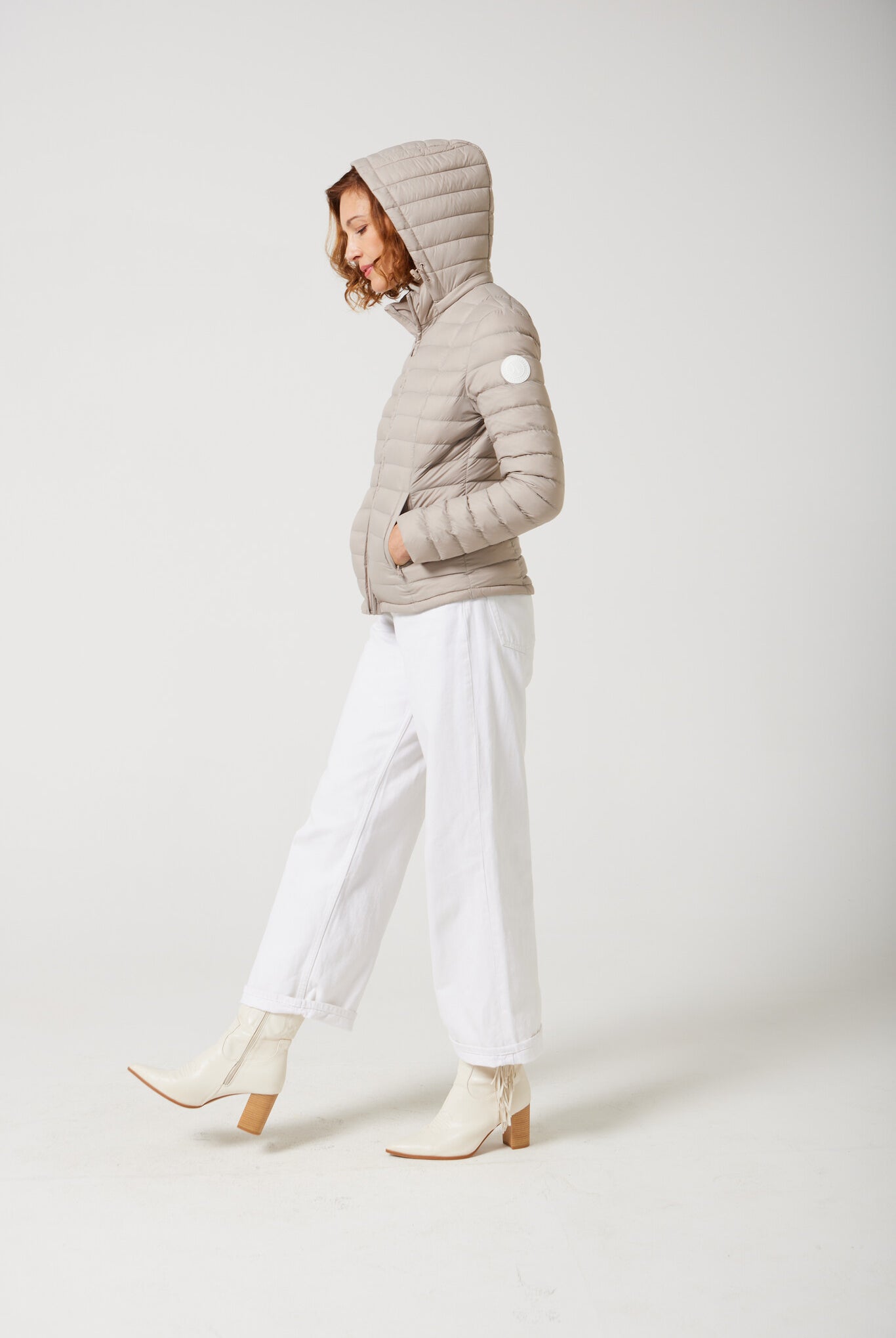 Women’s Latte Classic Jacket™ in a soft beige shade, lightweight puffer jacket with hood, perfect for layering during cool South African weather