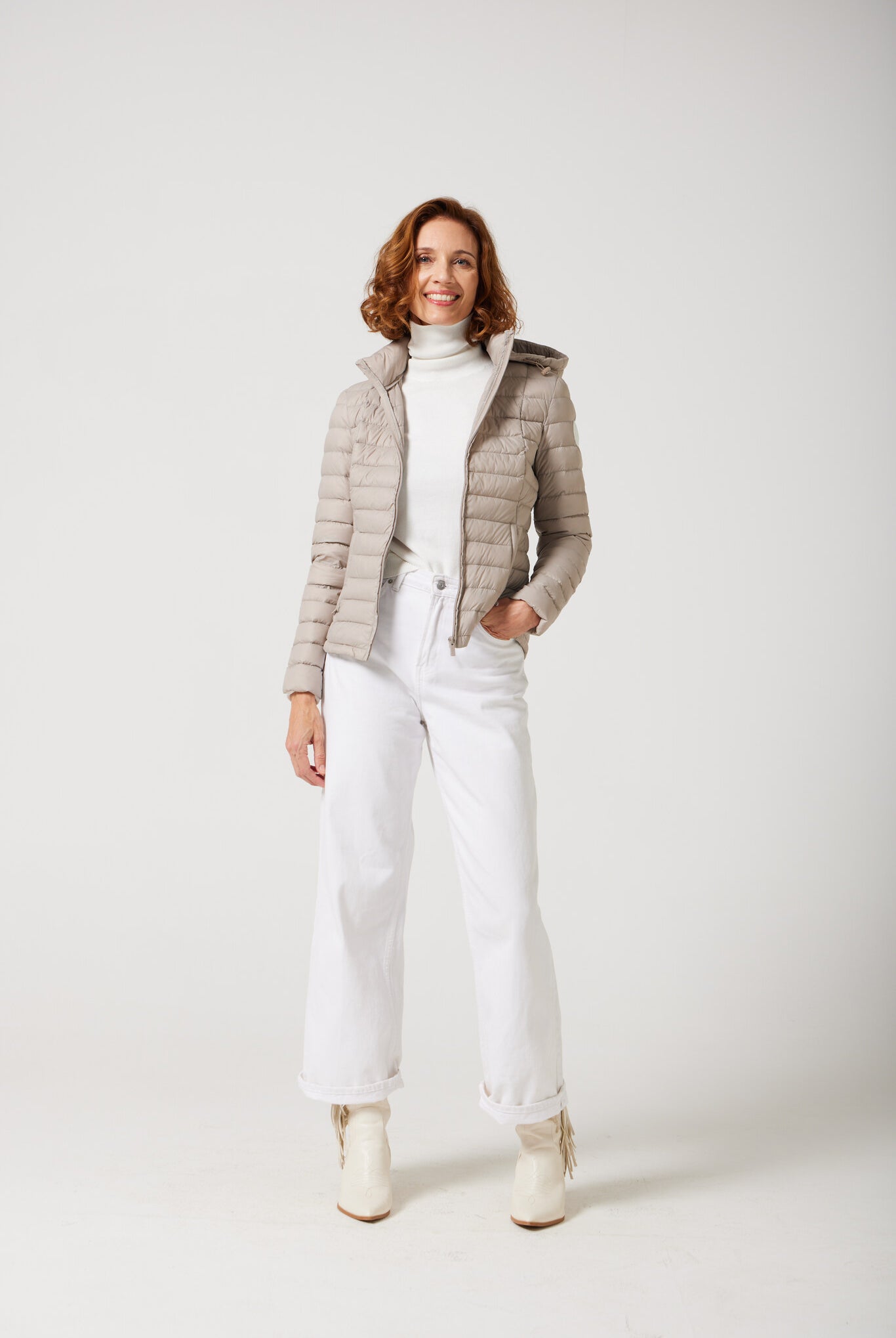 Women’s Latte Classic Jacket™ in a soft beige shade, lightweight puffer jacket with hood, perfect for layering during cool South African weather