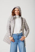 Women’s insulated hooded parka in latte, designed for warmth and comfort in South Africa’s winter season — Latte Classic Parka™