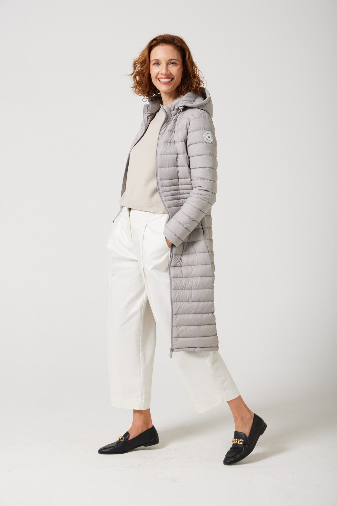 Women’s insulated ultra-length hooded parka in latte beige, designed for extra warmth and comfort in South Africa’s winter season — Latte Ultra Parka™