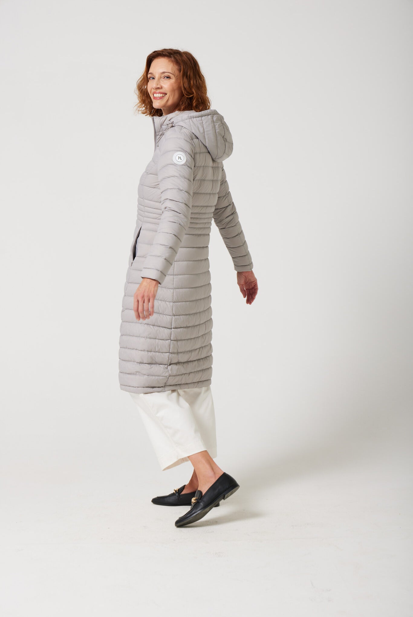 Women’s insulated ultra-length hooded parka in latte beige, designed for extra warmth and comfort in South Africa’s winter season — Latte Ultra Parka™