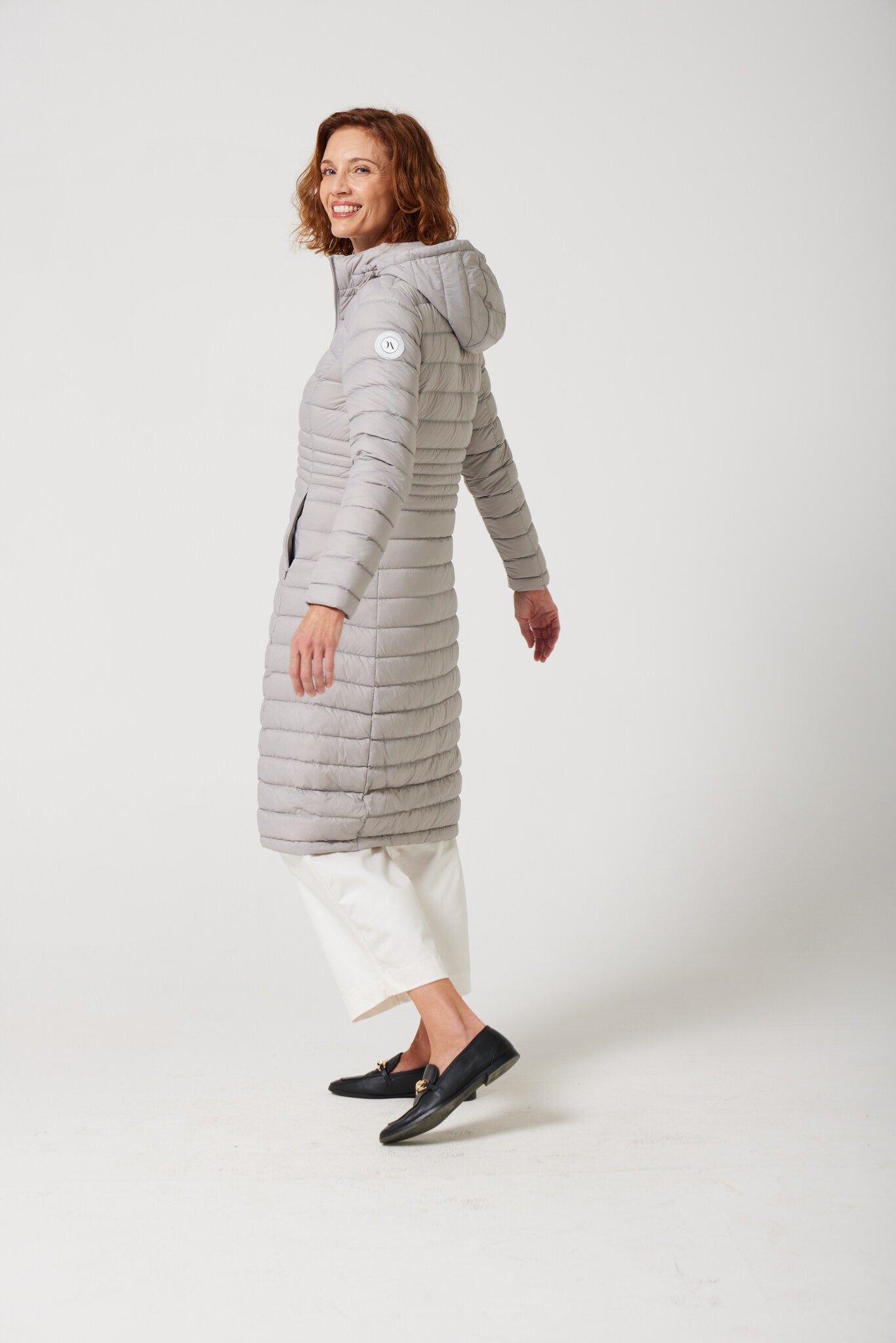 Women’s insulated ultra-length hooded parka in latte beige, designed for extra warmth and comfort in South Africa’s winter season — Latte Ultra Parka™