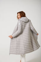 Women’s insulated ultra-length hooded parka in latte beige, designed for extra warmth and comfort in South Africa’s winter season — Latte Ultra Parka™