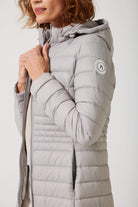 Women’s insulated ultra-length hooded parka in latte beige, designed for extra warmth and comfort in South Africa’s winter season — Latte Ultra Parka™