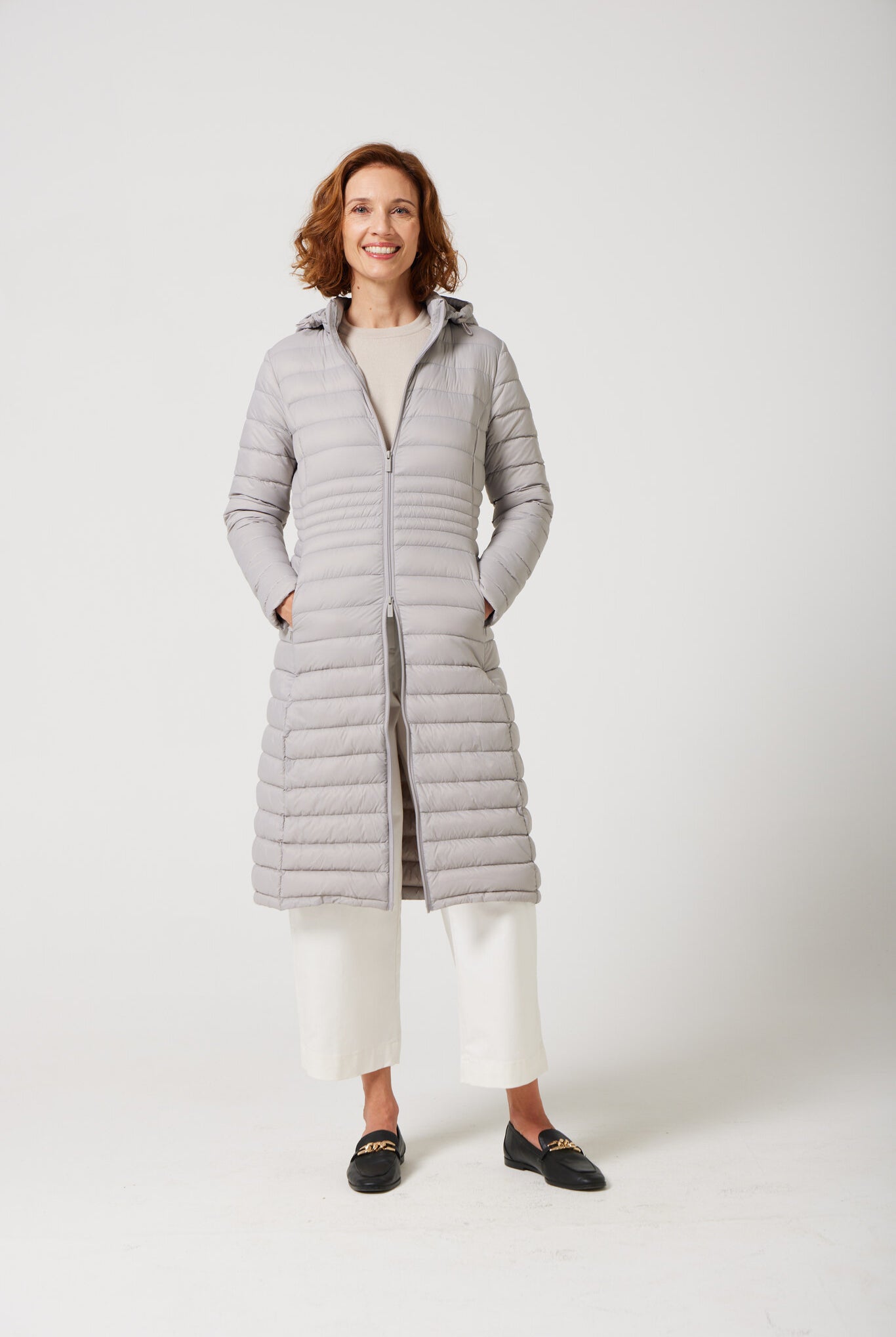 Women’s insulated ultra-length hooded parka in latte beige, designed for extra warmth and comfort in South Africa’s winter season — Latte Ultra Parka™