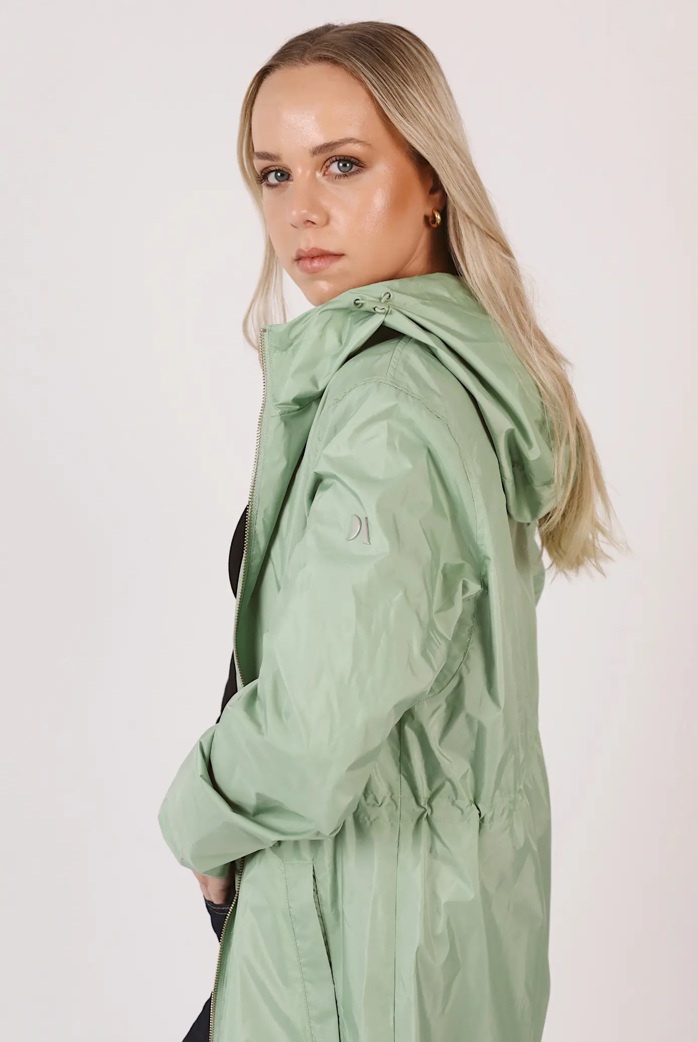 Madame Verde Vol 1 raincoat in light green with hood, stylish waterproof jacket for rainy days in South Africa