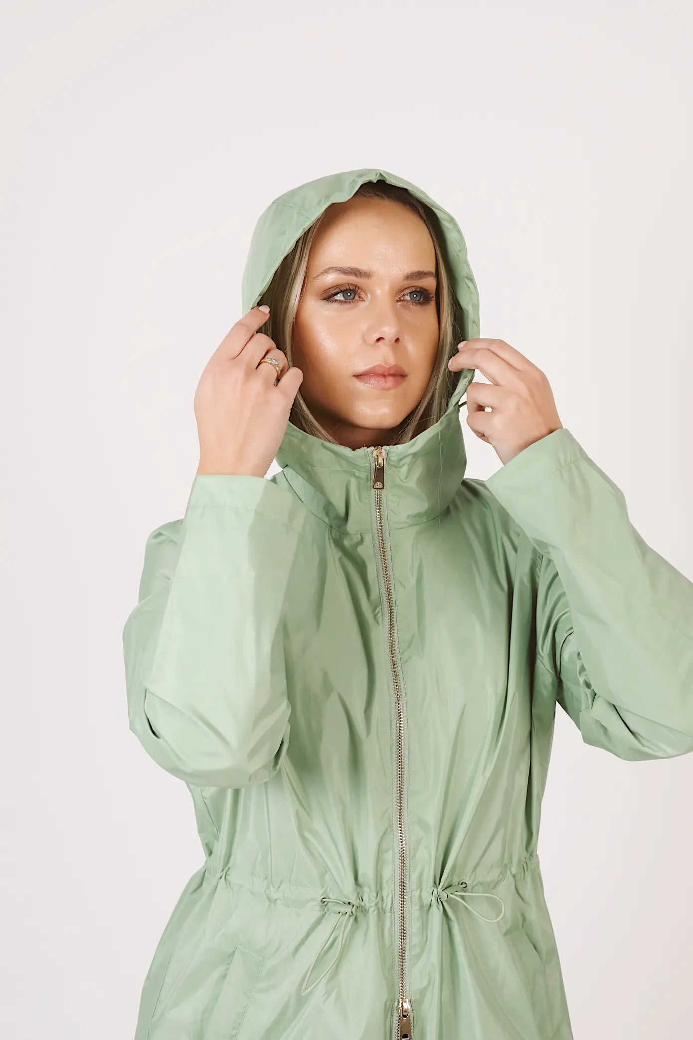 Madame Verde Vol 1 raincoat in light green with hood, stylish waterproof jacket for rainy days in South Africa