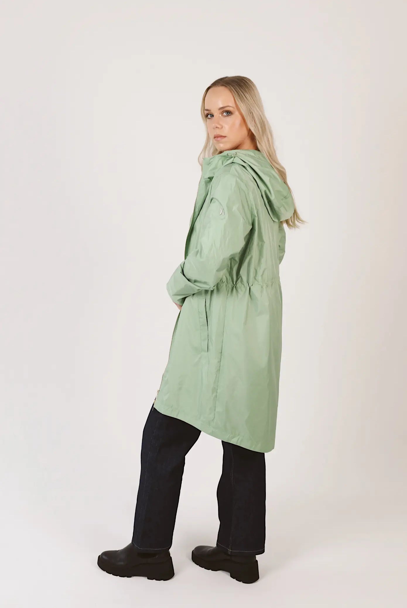 Madame Verde Vol 1 raincoat in light green with hood, stylish waterproof jacket for rainy days in South Africa