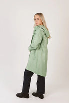 Madame Verde Vol 1 raincoat in light green with hood, stylish waterproof jacket for rainy days in South Africa