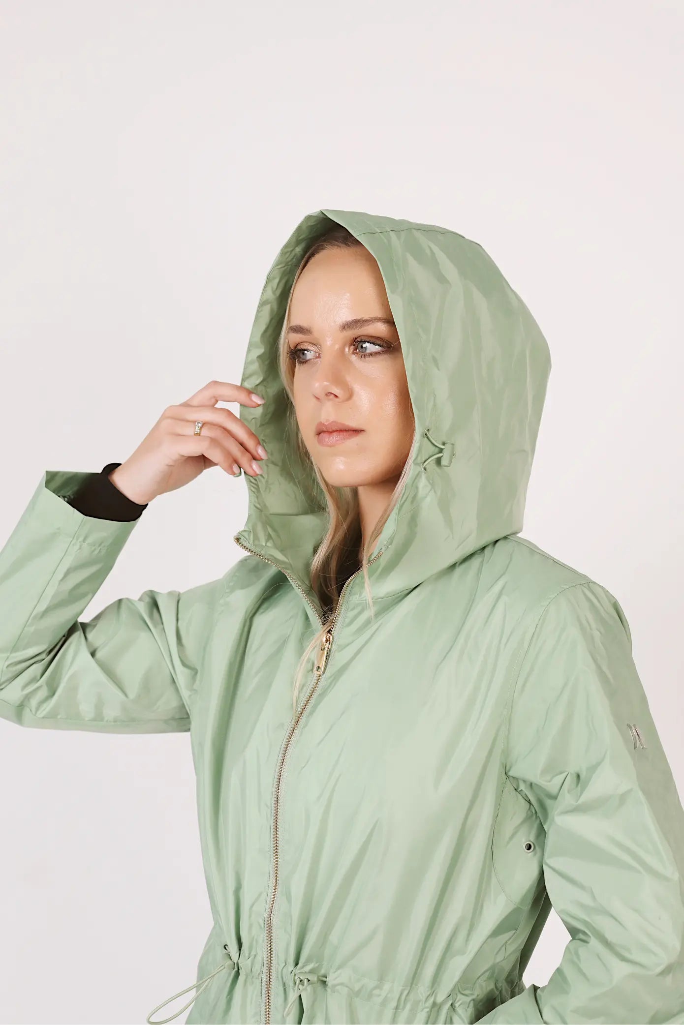 Madame Verde Vol 1 raincoat in light green with hood, stylish waterproof jacket for rainy days in South Africa