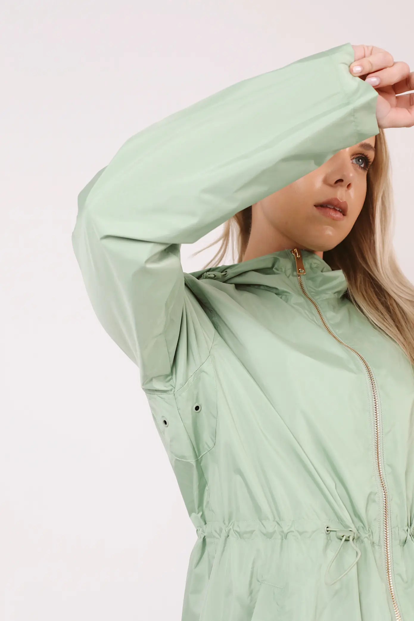 Madame Verde Vol 1 raincoat in light green with hood, stylish waterproof jacket for rainy days in South Africa