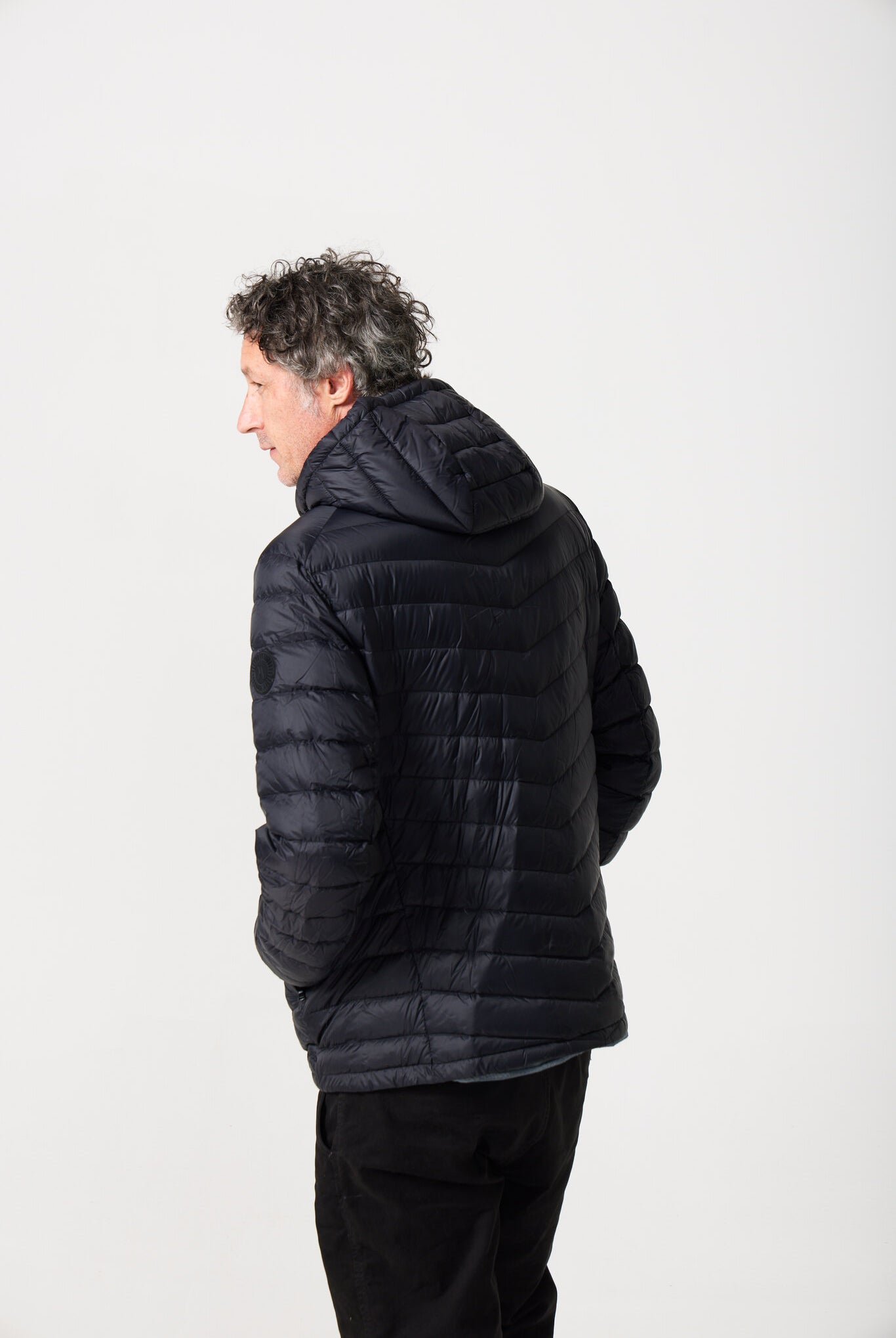Men’s Black Classic Jacket™ in sleek black, lightweight hooded puffer jacket for layering in cool South African weather