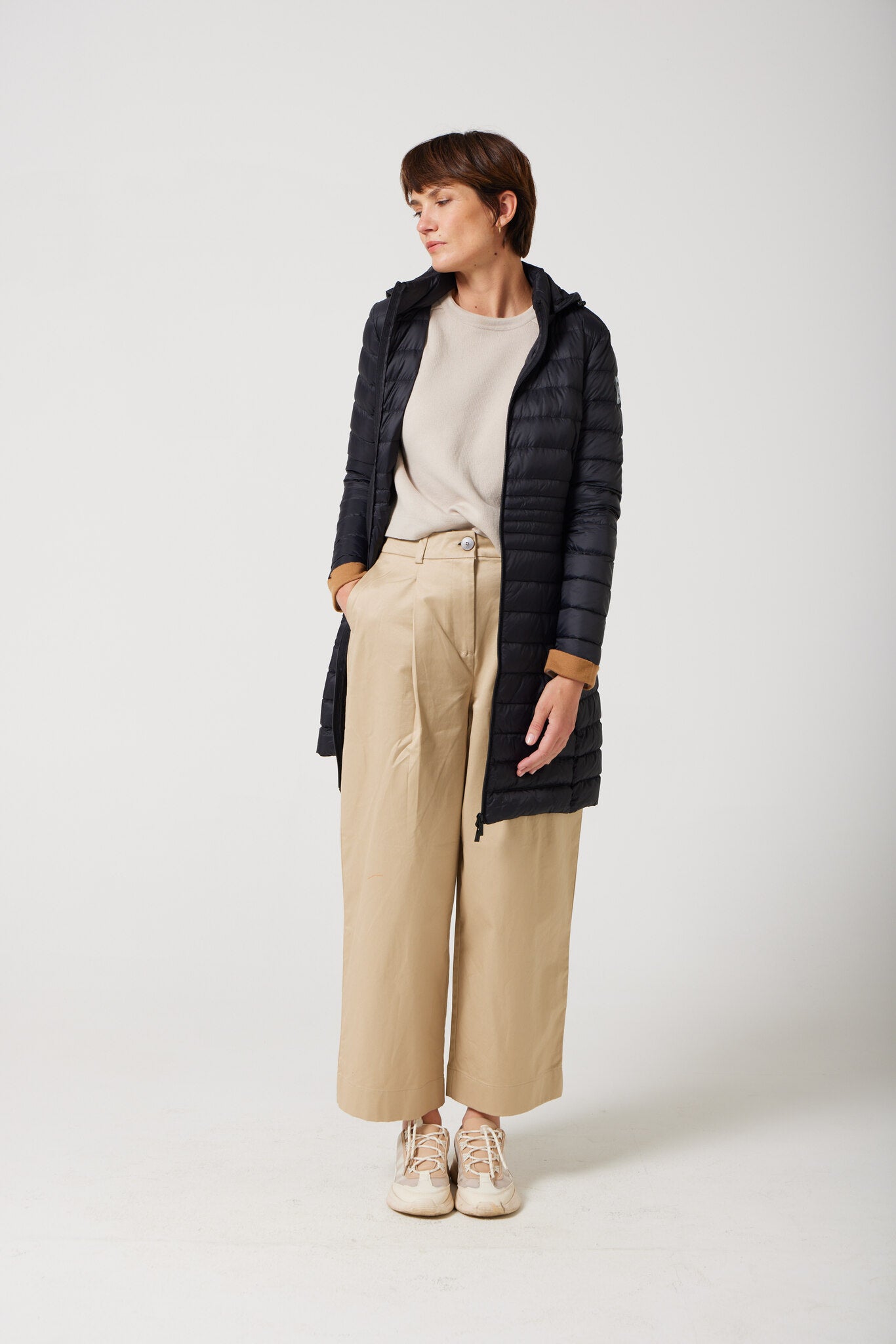 Women’s insulated midi-length hooded parka in midnight black, designed for warmth and comfort in South Africa’s winter season — Midnight Midi Parka™