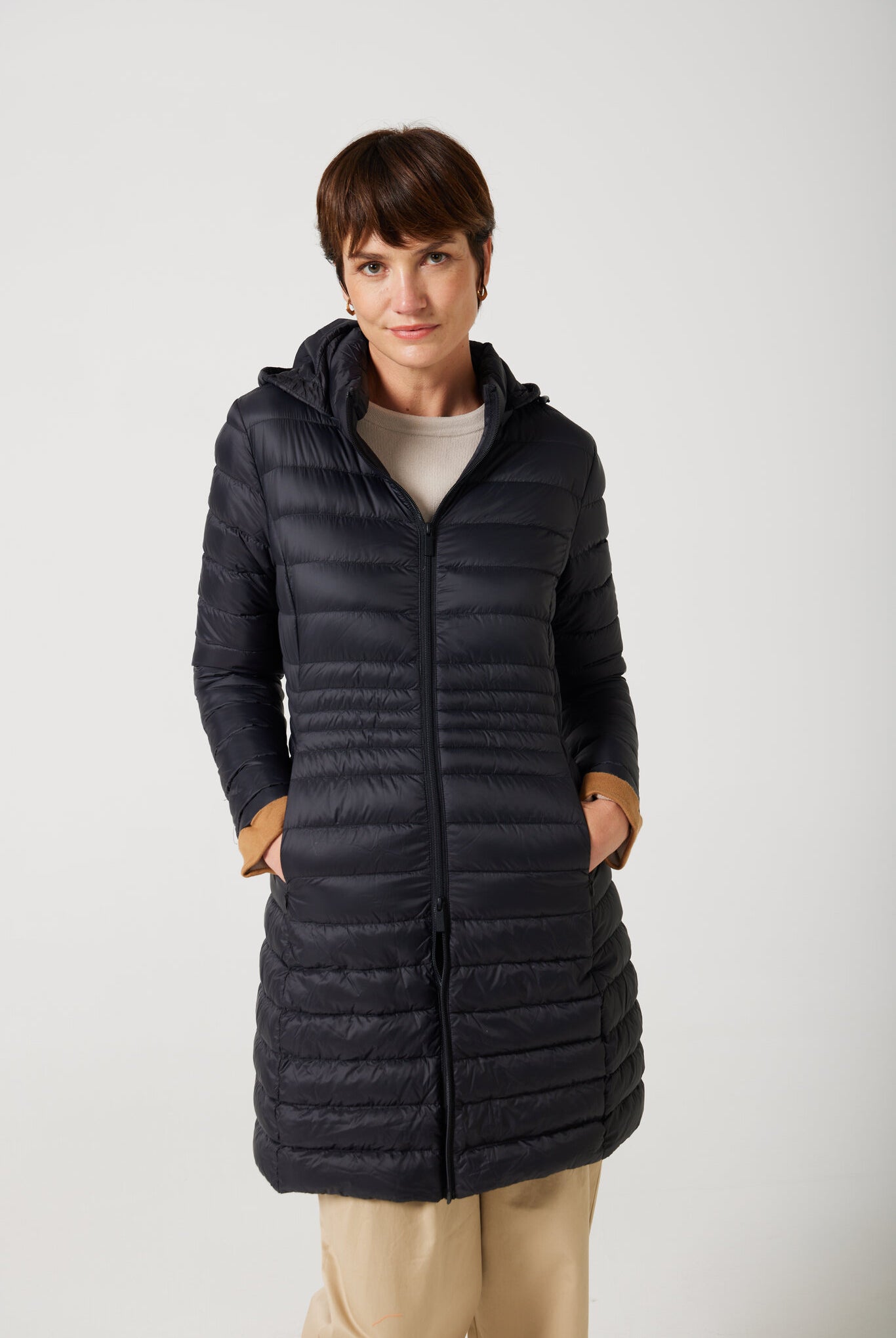 Women’s insulated midi-length hooded parka in midnight black, designed for warmth and comfort in South Africa’s winter season — Midnight Midi Parka™
