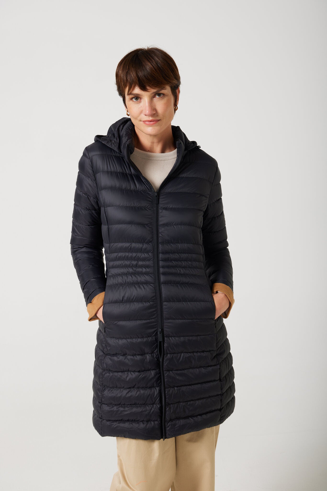 Women’s insulated midi-length hooded parka in midnight black, designed for warmth and comfort in South Africa’s winter season — Midnight Midi Parka™