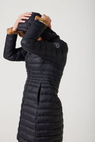 Women’s insulated midi-length hooded parka in midnight black, designed for warmth and comfort in South Africa’s winter season — Midnight Midi Parka™