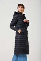 Women’s insulated ultra-length hooded parka in midnight black, designed for extra warmth and comfort in South Africa’s winter season — Midnight Ultra Parka™