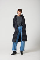 Women’s insulated ultra-length hooded parka in midnight black, designed for extra warmth and comfort in South Africa’s winter season — Midnight Ultra Parka™