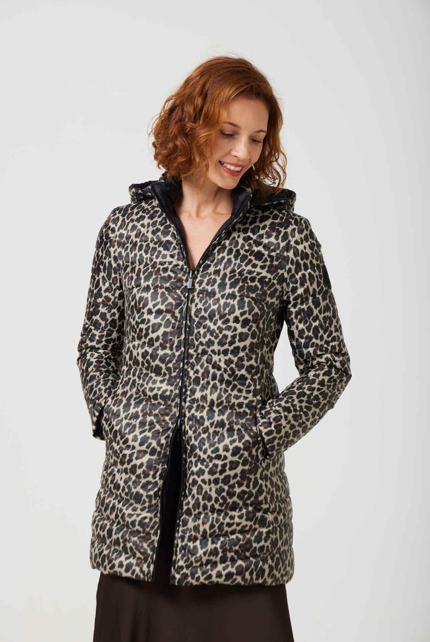 Women’s insulated reversible hooded parka in leopard print and midnight black, designed for warmth and comfort in South Africa’s winter season — Midnight x Leopard Classic Parka™