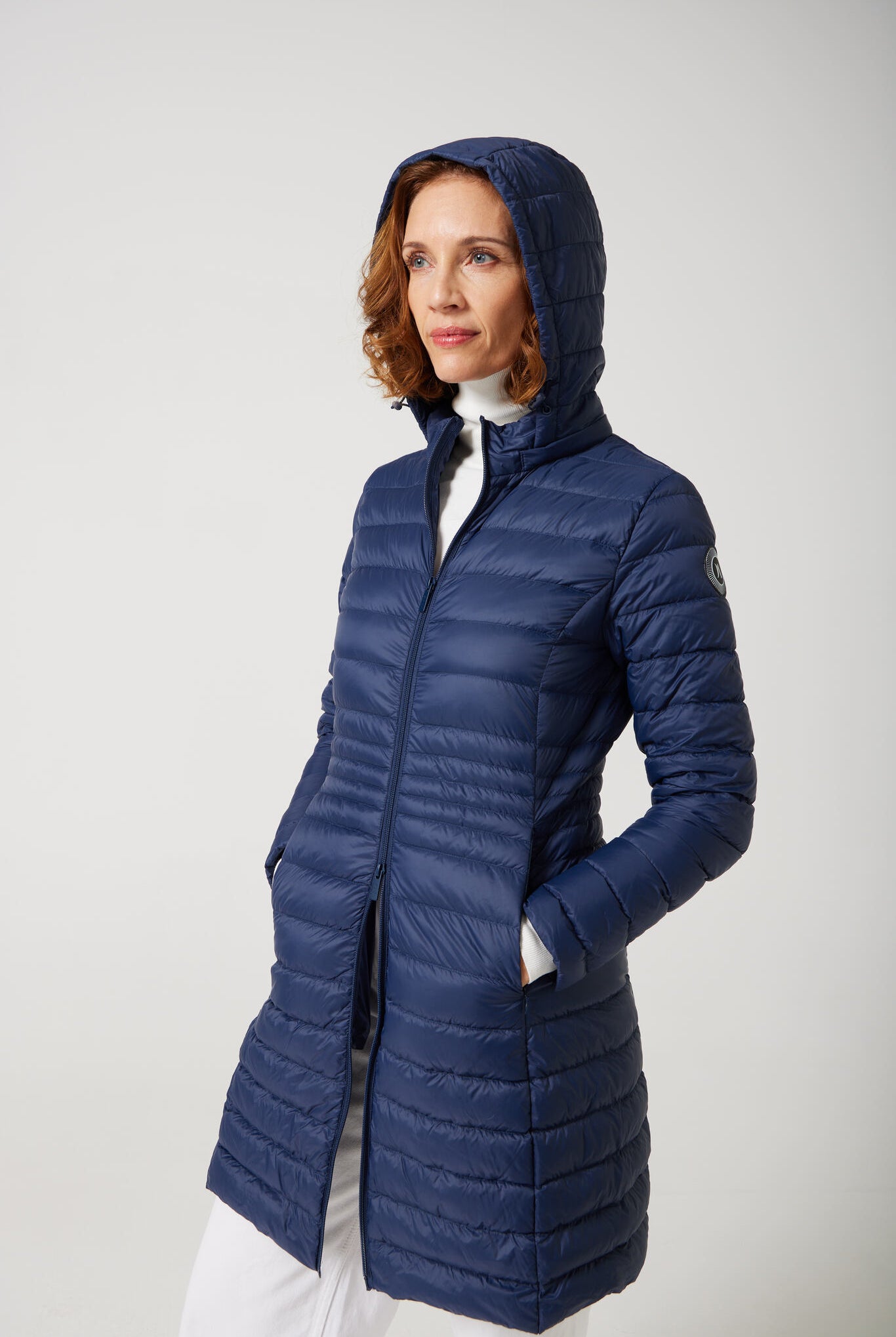 Women’s insulated midi-length hooded parka in navy blue, designed for warmth and comfort in South Africa’s winter season — Navy Midi Parka™