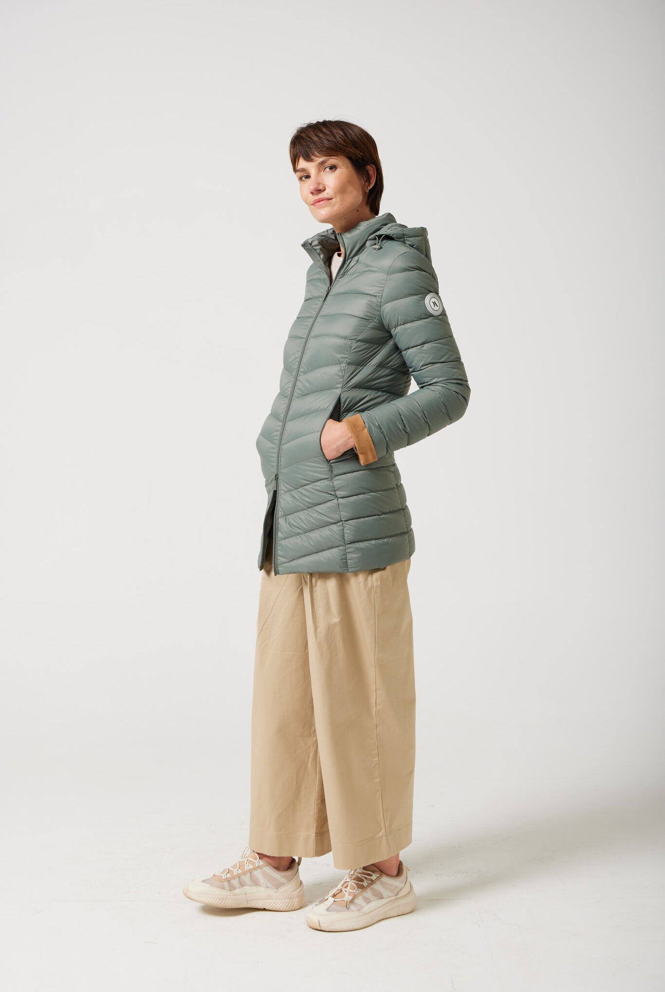 Women’s insulated hooded parka in sage green, designed for warmth and comfort in South Africa’s winter season — Sage Classic Parka™