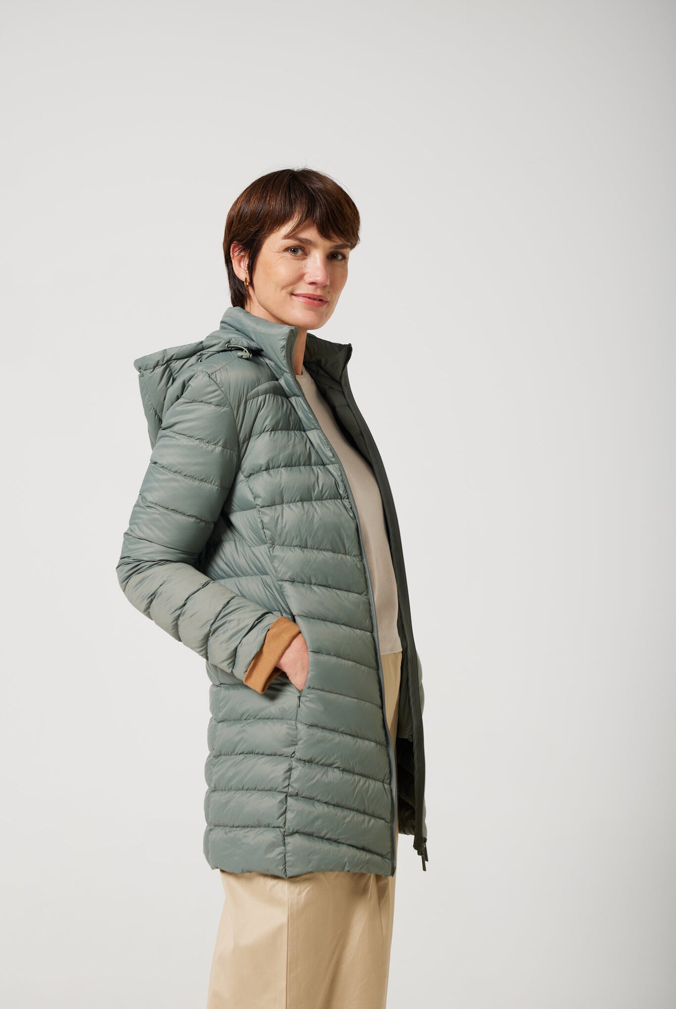 Women’s insulated hooded parka in sage green, designed for warmth and comfort in South Africa’s winter season — Sage Classic Parka™