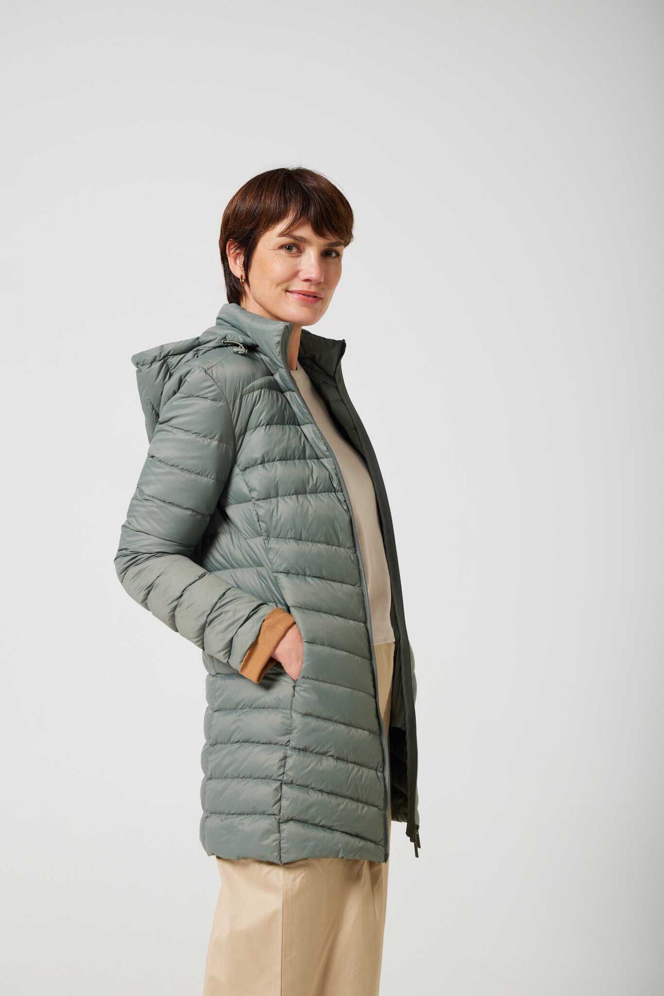 Women’s insulated hooded parka in sage green, designed for warmth and comfort in South Africa’s winter season — Sage Classic Parka™