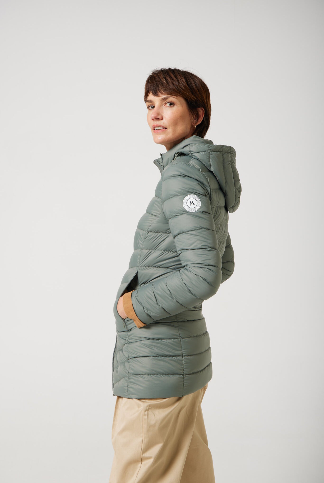 Women’s insulated hooded parka in sage green, designed for warmth and comfort in South Africa’s winter season — Sage Classic Parka™