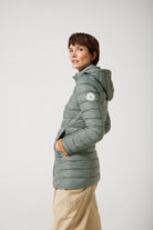 Women’s insulated hooded parka in sage green, designed for warmth and comfort in South Africa’s winter season — Sage Classic Parka™