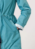 Windsor Azure raincoat in turquoise, lightweight hooded waterproof raincoat ideal for South Africa’s rainy season and wet climate