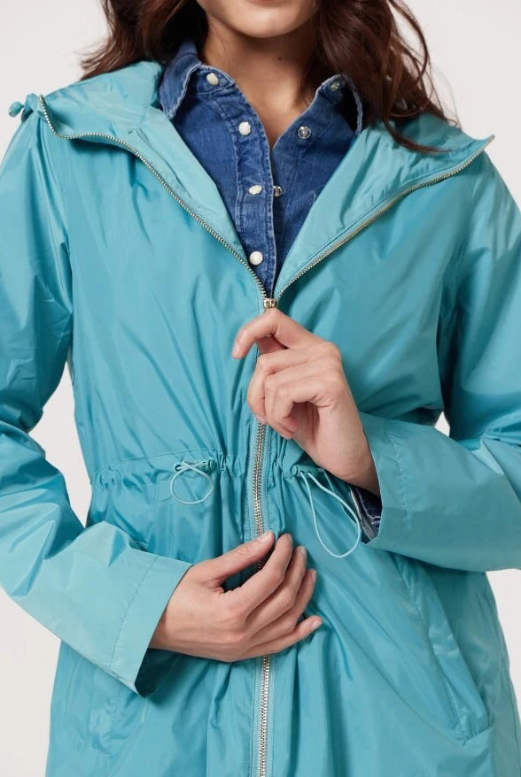 Windsor Azure raincoat in turquoise, lightweight hooded waterproof raincoat ideal for South Africa’s rainy season and wet climate