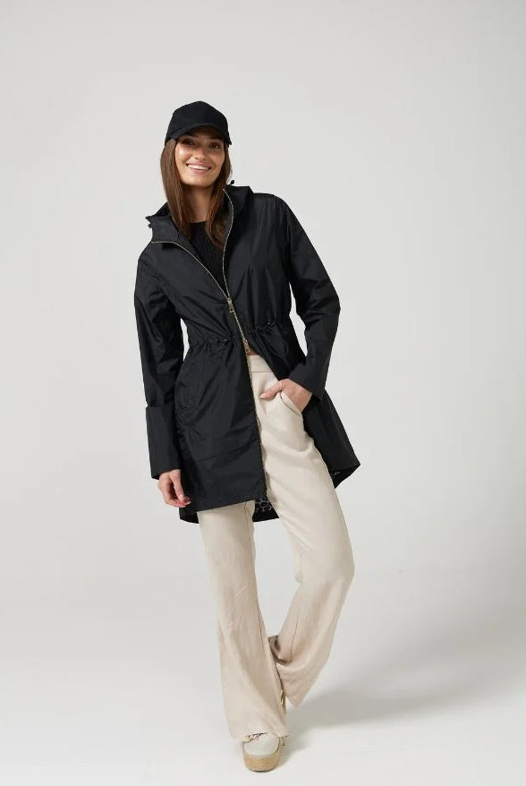 The Highland Midnight raincoat in classic black, lightweight hooded waterproof raincoat ideal for South Africa’s rainy season and wet climate