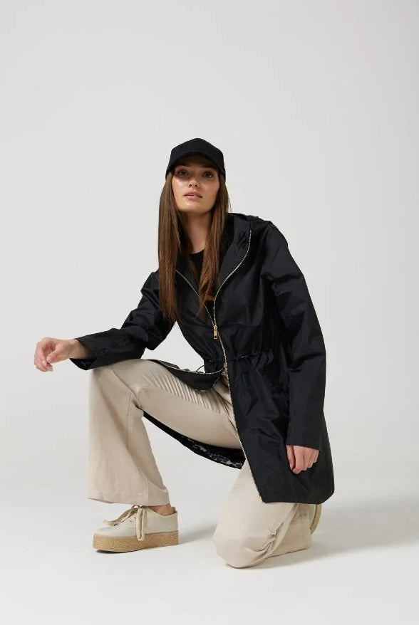 The Highland Midnight raincoat in classic black, lightweight hooded waterproof raincoat ideal for South Africa’s rainy season and wet climate