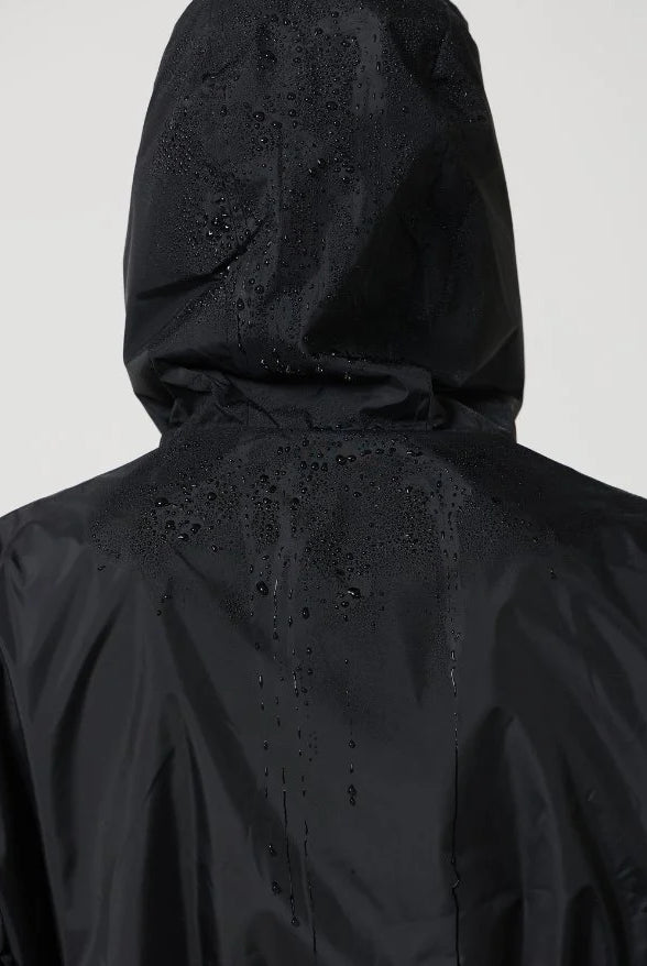 The Highland Midnight raincoat in classic black, lightweight hooded waterproof raincoat ideal for South Africa’s rainy season and wet climate