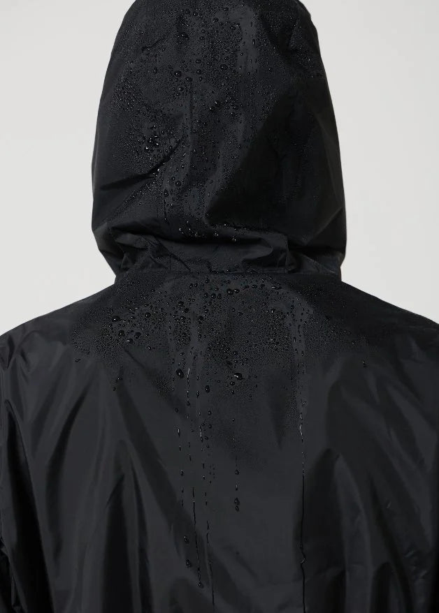 The Highland Midnight raincoat in classic black, lightweight hooded waterproof raincoat ideal for South Africa’s rainy season and wet climate