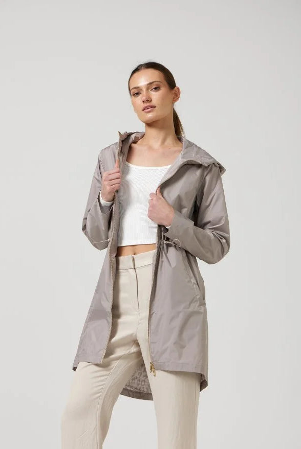 The Cairo Sands raincoat in beige, lightweight hooded waterproof raincoat ideal for South Africa’s rainy season and wet climate