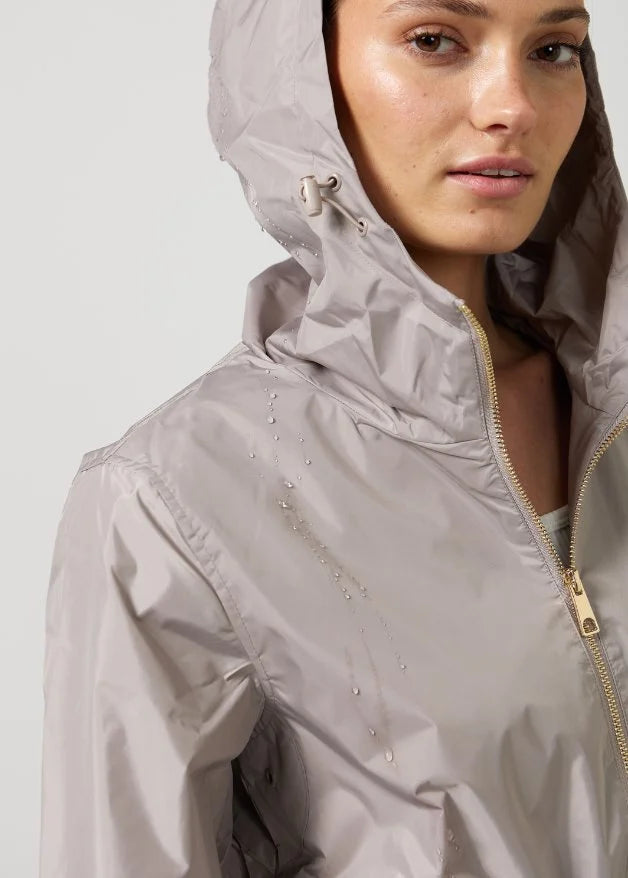 The Cairo Sands raincoat in beige, lightweight hooded waterproof raincoat ideal for South Africa’s rainy season and wet climate