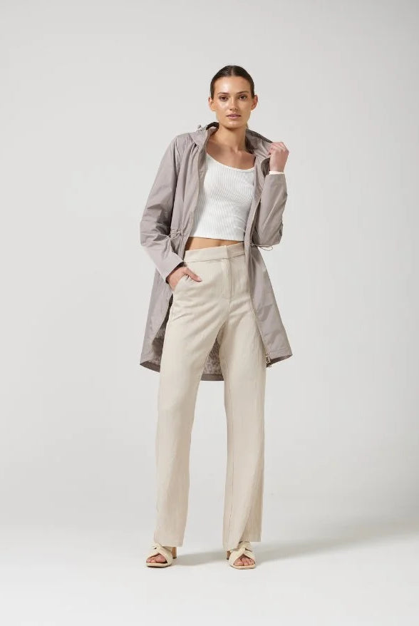 The Cairo Sands raincoat in beige, lightweight hooded waterproof raincoat ideal for South Africa’s rainy season and wet climate