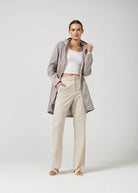 The Cairo Sands raincoat in beige, lightweight hooded waterproof raincoat ideal for South Africa’s rainy season and wet climate